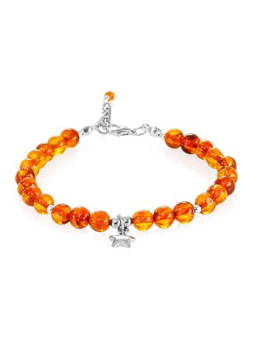 Delicate bracelet made of natural cognac amber with a star-shaped pendant, image 